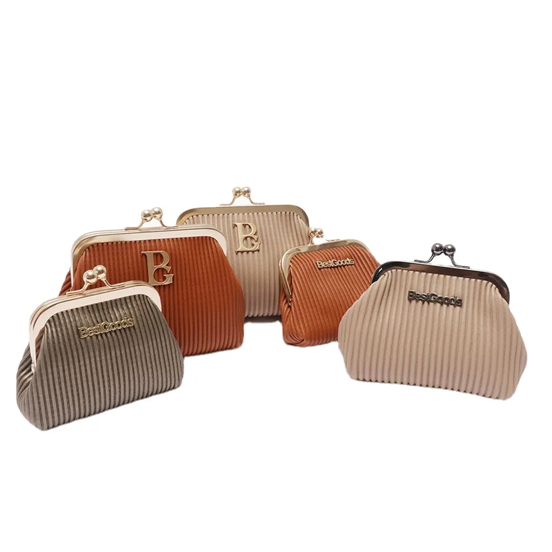 Five pleated corduroy kiss-lock coin purses in earth tones with BestGoods metal logo and ball-clasp frames on white background