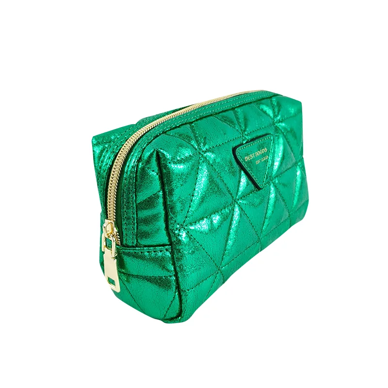 Metallic emerald green diamond-quilted boxy cosmetic pouch with gold zipper and triangle logo patch on white background