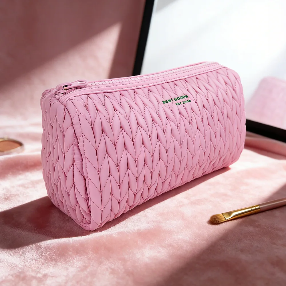 Color variant — pink quilted barrel pouch with embroidery
