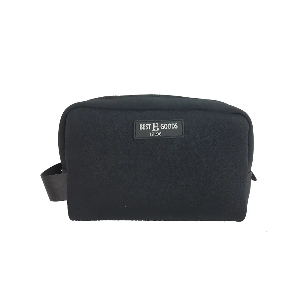 Black neoprene zip-top toiletry case with woven BEST B GOODS EST.2008 label, black webbing pull, on pure white background