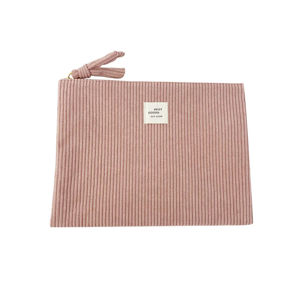 Dusty-pink wide-wale corduroy flat zip pouch with knotted fabric pull and cream BEST GOODS woven label on white background