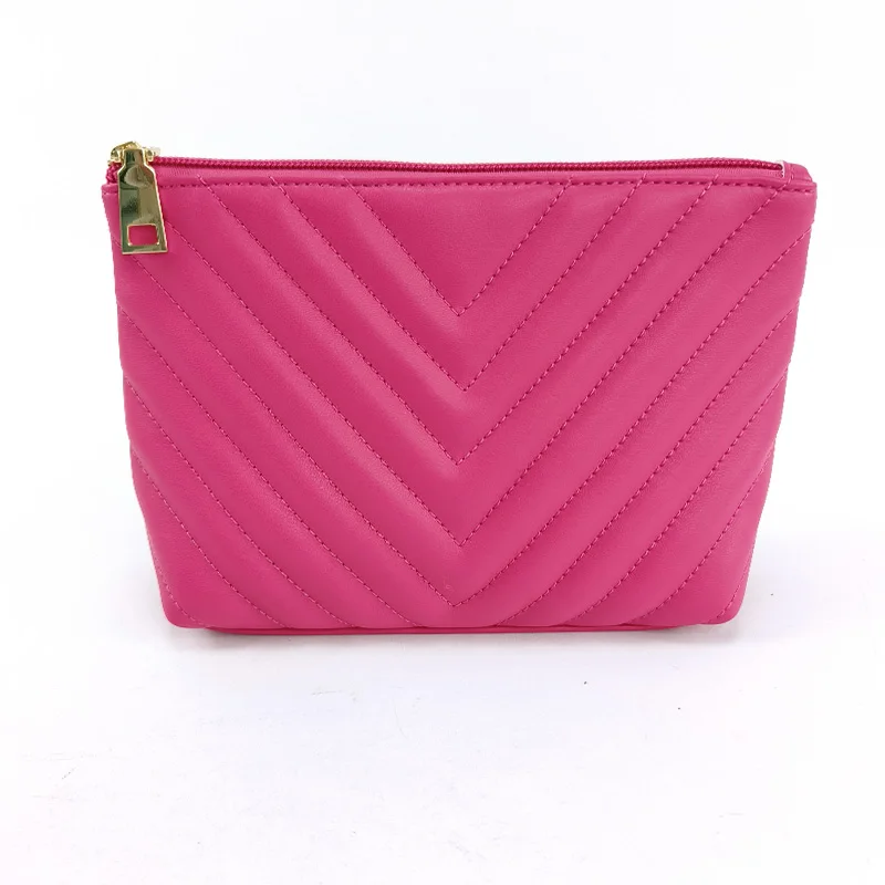 Hot pink chevron-quilted PU leather makeup pouch with gold zipper pull on white background