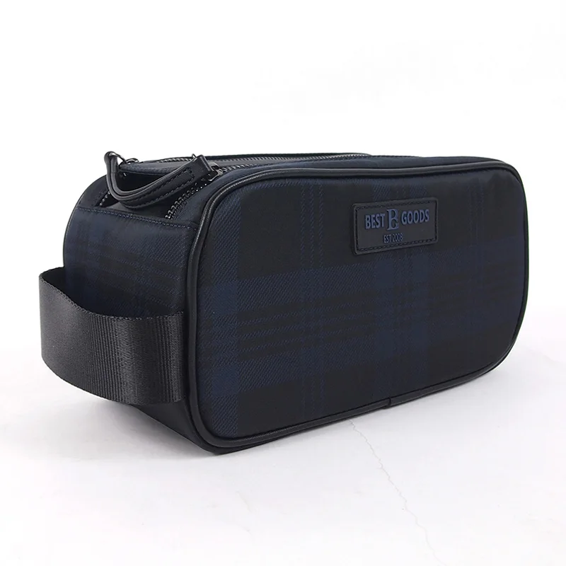 Navy tartan toiletry box case with black webbing side handle and BEST R GOODS woven label, studio shot on white background