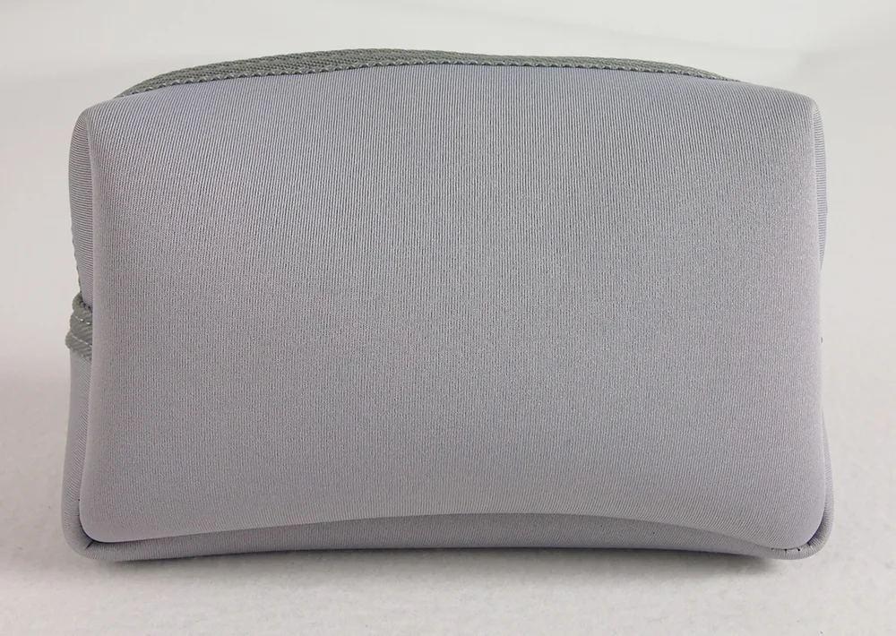 Light gray-lavender rectangular zippered cosmetic pouch with smooth scuba fabric on white background