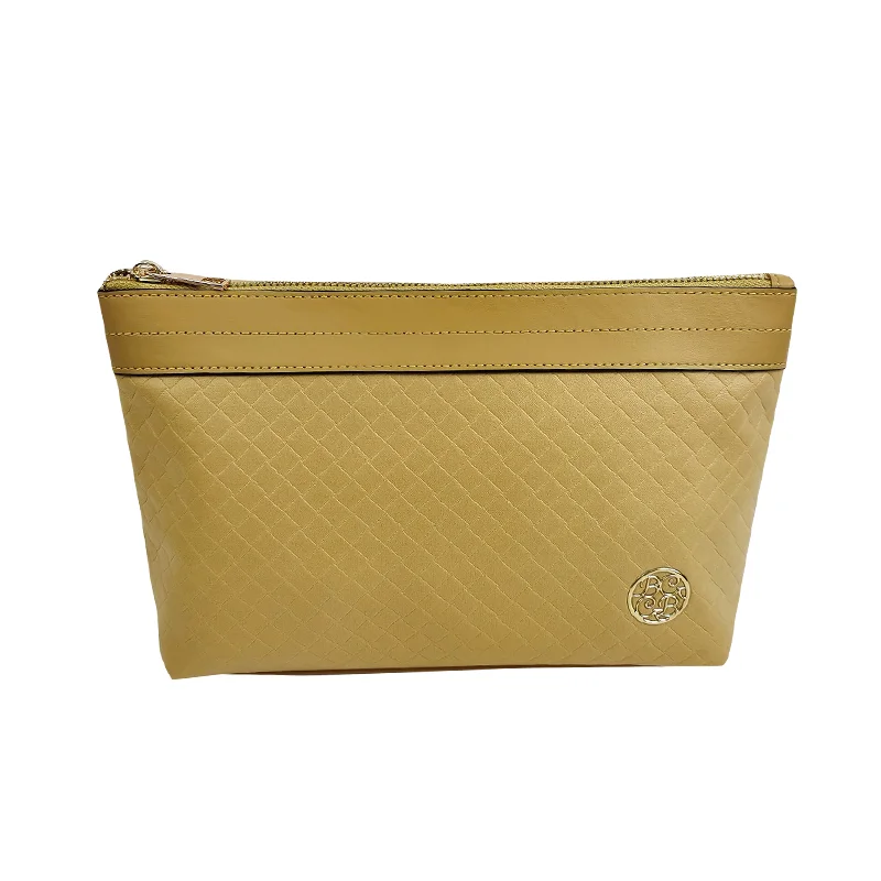 Mustard-yellow faux-leather cosmetic pouch with embossed basketweave texture, gold zipper pull, matching top cuff, and round gold medallion logo at lower right, front view on pure white background